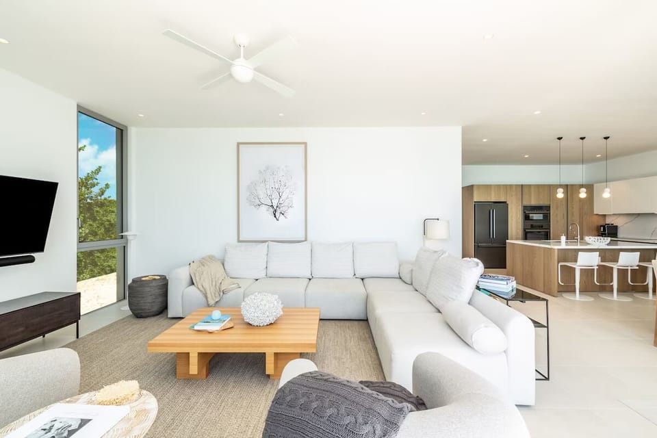 Stretch out together in a sunlit open-plan living space.