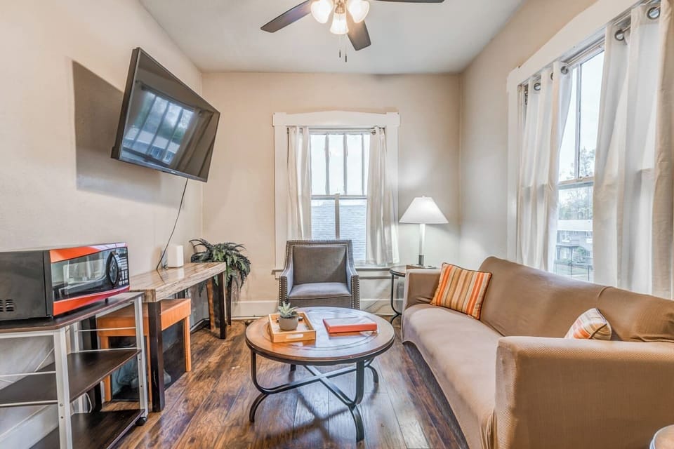 Relax with a quiet evening on the couch while streaming a show or enjoying conversation in this bright and comfy living space.