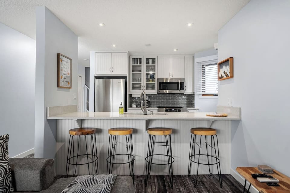 Full kitchen with a drip coffee maker, kettle, and all essentials (coffee grounds, sugar, tea, ketchup, mustard & relish.)