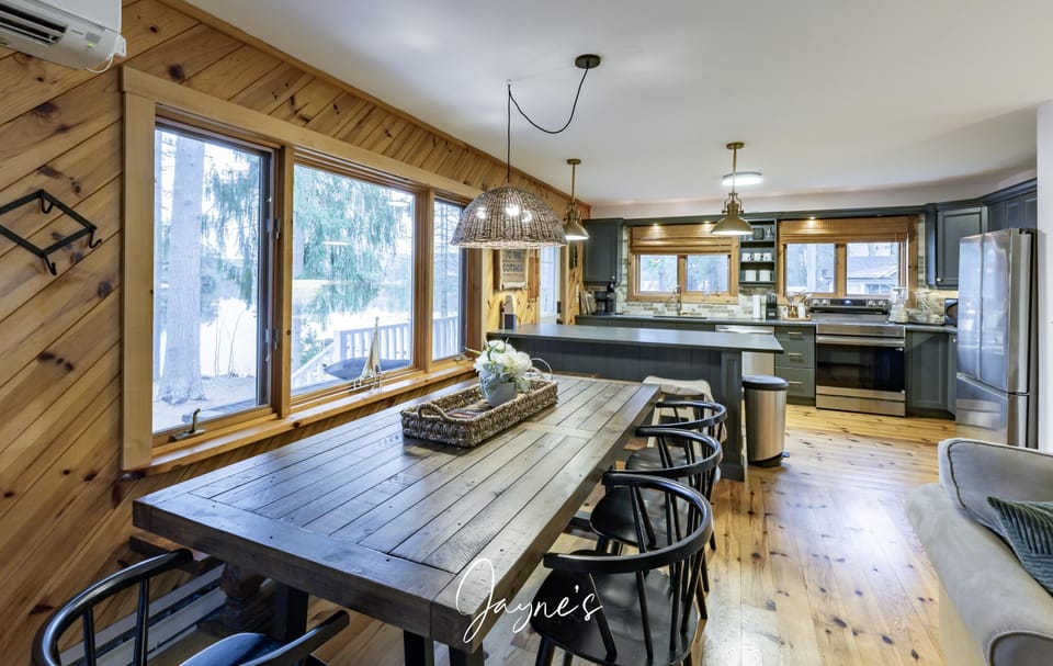 Spacious dining area with mountain views and cozy wood accents