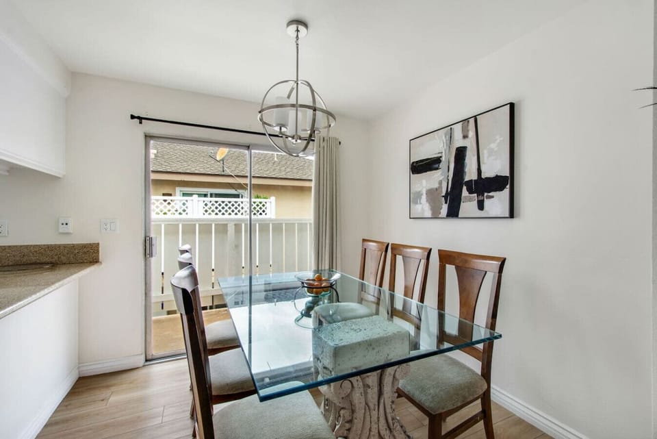 Dining area with table seating for six and patio access