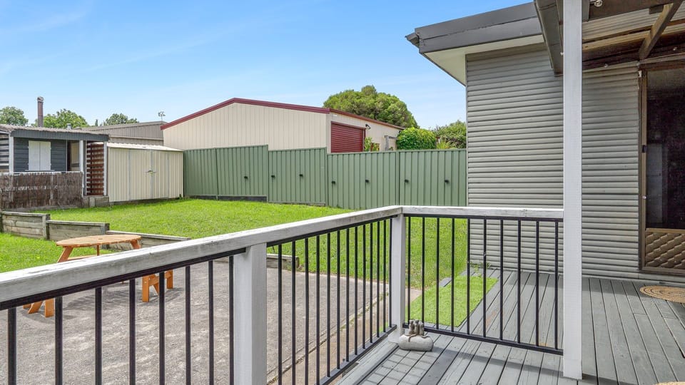 Relaxing outdoor deck overlooking the spacious backyard