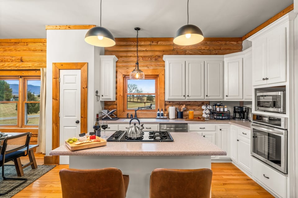 A fully equipped kitchen ready for cooking for-a-crowd. Stainless appliances, generous counter space, and everything your group
needs for big family meals.
