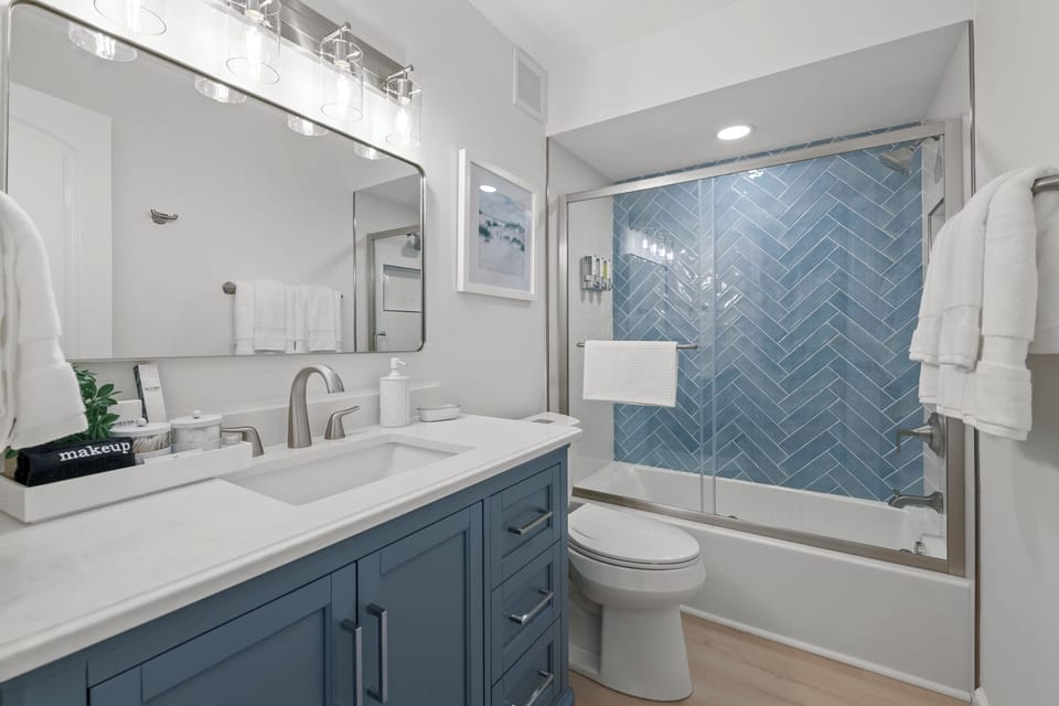 Spa inspired bathroom stocked with essentials for a refreshing, stress-free stay