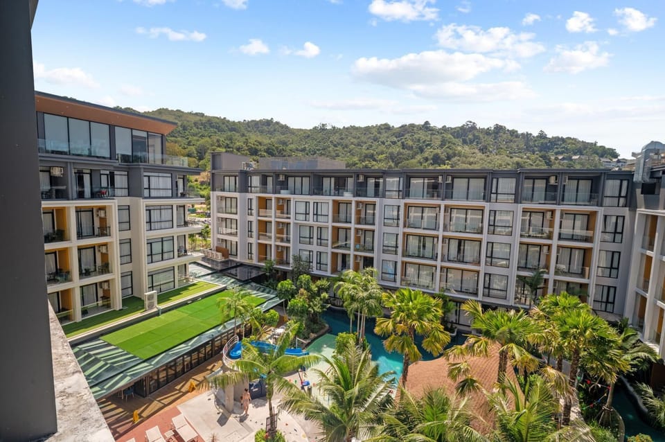 Wide-angle view of the property showcasing modern building design and landscaped outdoor areas.