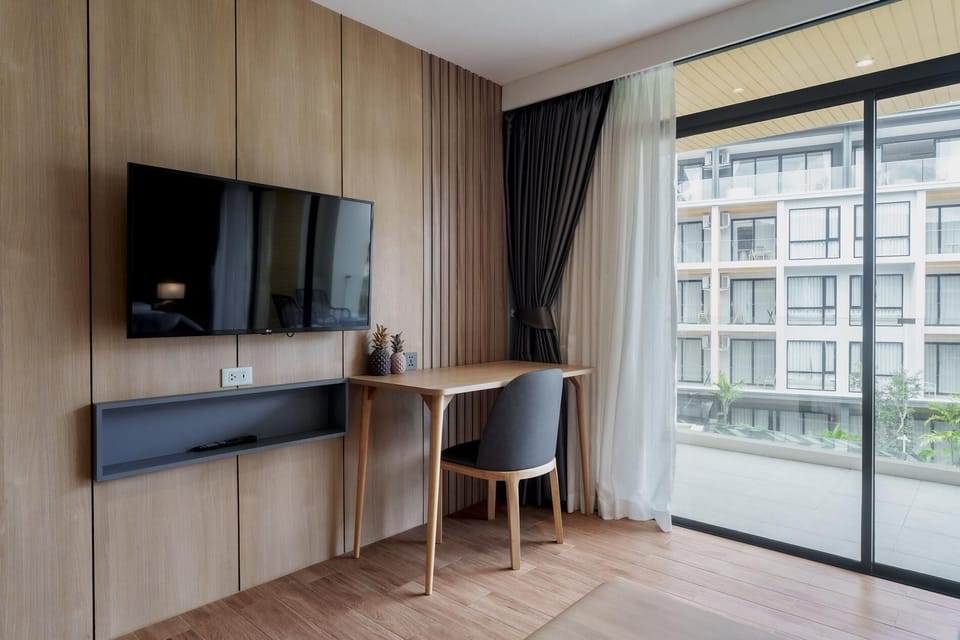 Bedroom area featuring a flat-screen TV, perfect for in-room entertainment.