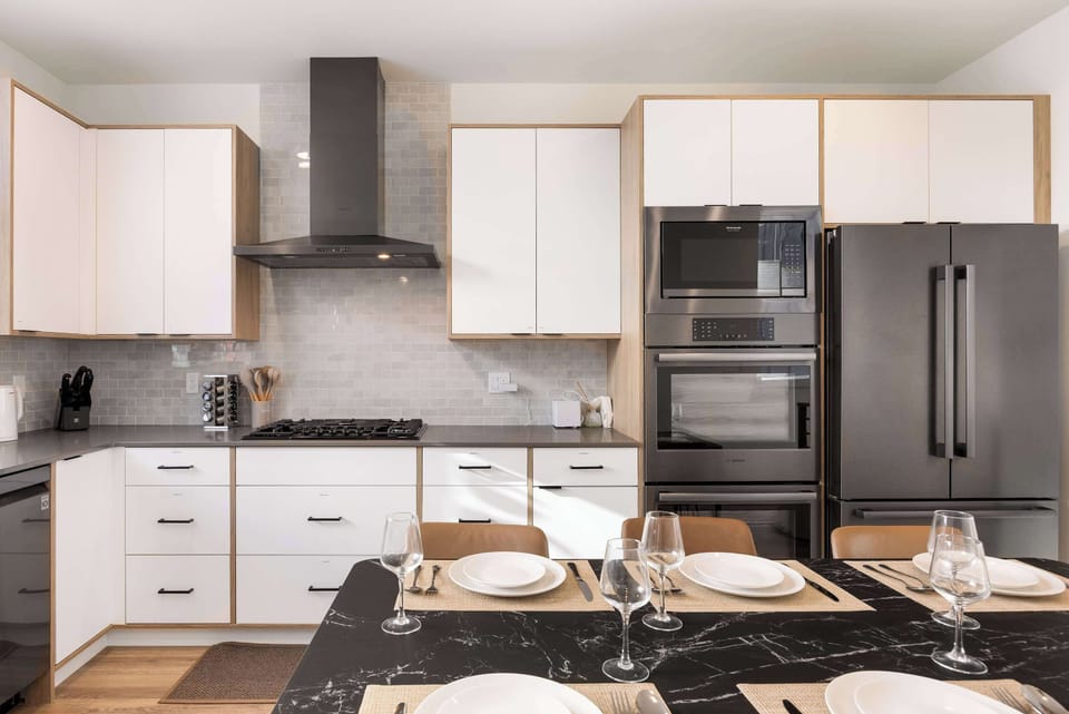 A fully equipped modern kitchen with premium appliances, perfect for cooking at home.