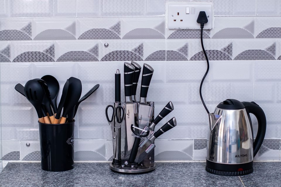 Fridge, microwave, electric kettle, cookware/dishes/utensils