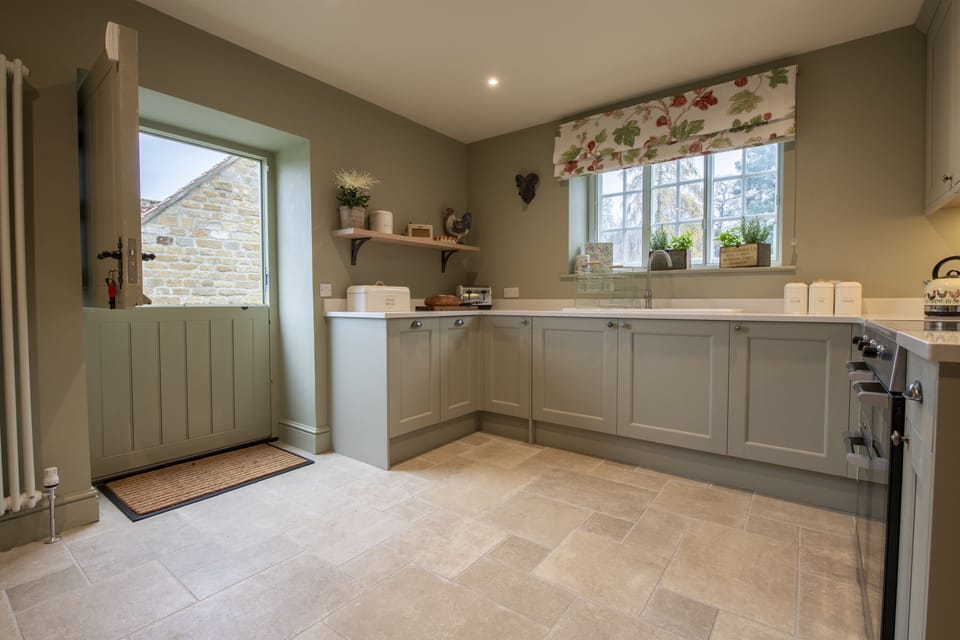 Ground floor: Kitchen leading out to the side of the cottage