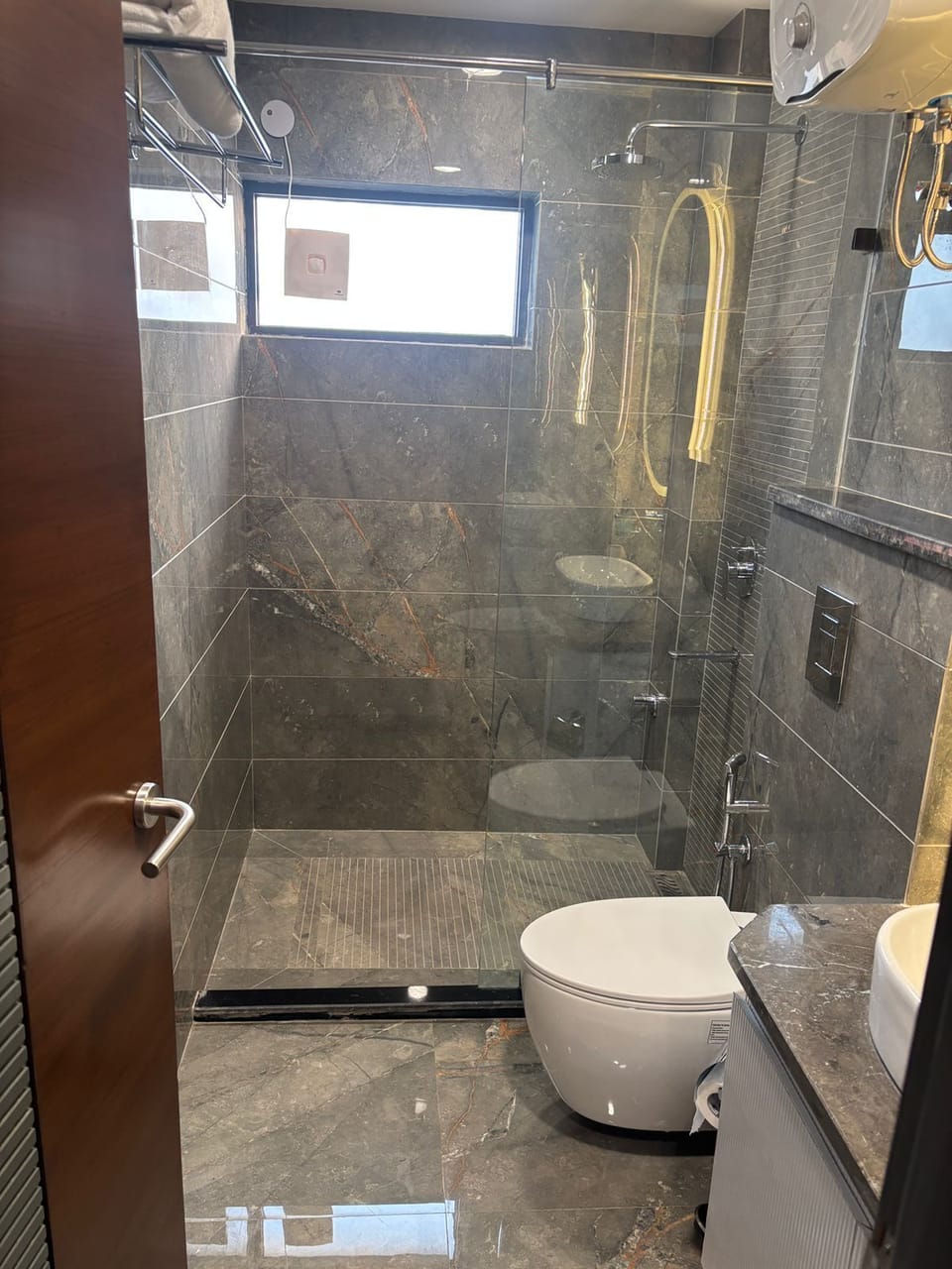 Shower, free toiletries, slippers, towels