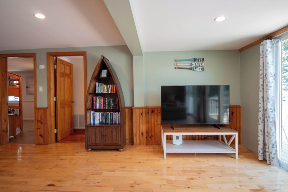 Large-screen TV for entertainment and a well-stocked library.