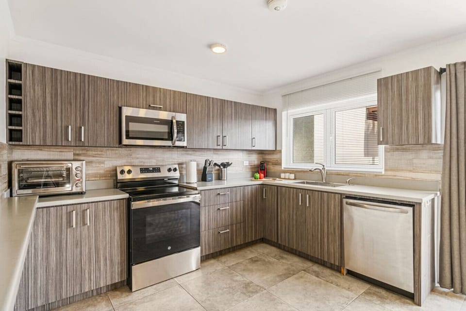 Modern kitchen with full amenities for easy island dining
