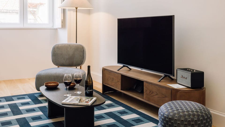 A bright, modern living area with a touch of color and sleek design — ideal for relaxing or entertaining.
#AndoLiving #Portugal #Santos #StylishHome #ModernLiving