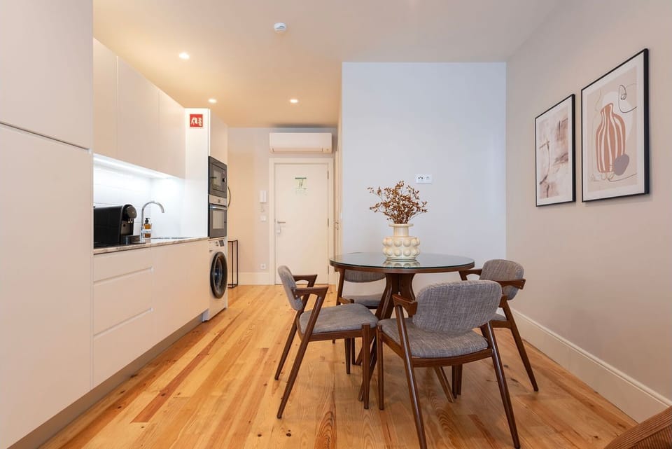 A sleek dining table, designed to accommodate intimate dinners or lively gatherings, takes center stage on this wonderful apartment.