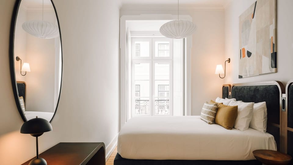 A bedroom with natural light and access to a balcony to enjoy the amazing view in the morning #bed #lisbon #pt #portugal