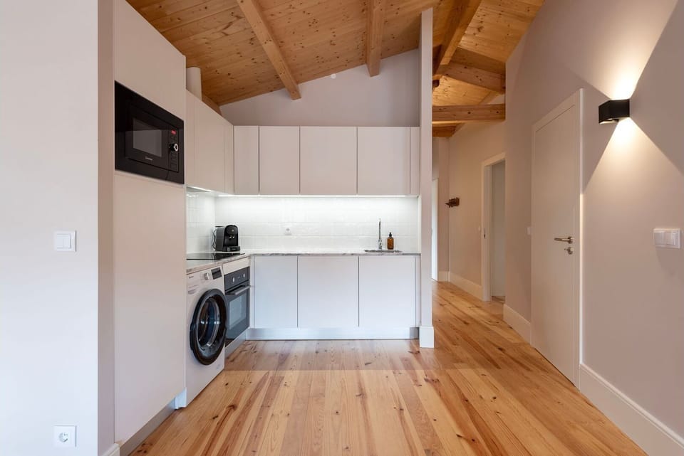 The minimalist design and premium finishes add an element of sophistication to our kitchenette. Soft under-cabinet lighting highlights the immaculate countertops.