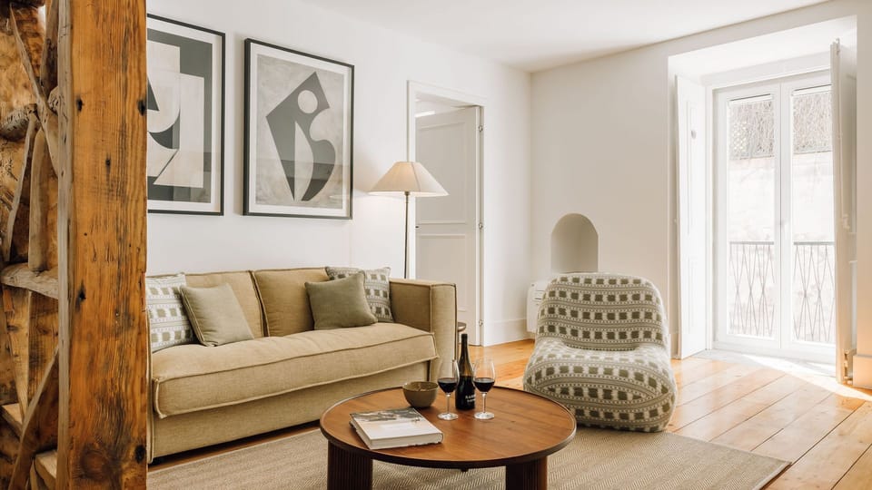 Modern dining and living space with natural light, warm wood flooring, minimalist furniture, and stylish decor. 
#InteriorDesign 
#ModernLiving 
#CozyHome 
#Minimalism
#AndoLiving