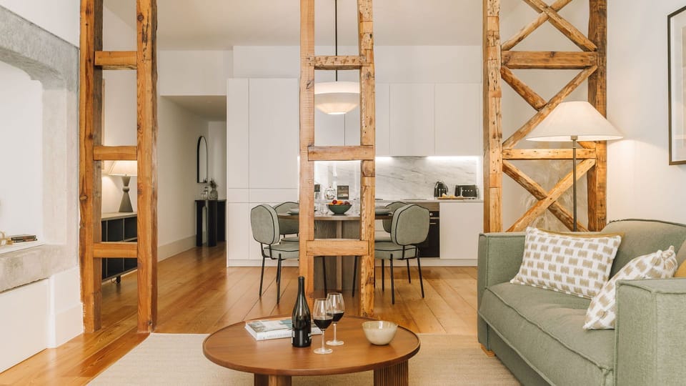 Elegant living area featuring textured chair, wooden desk, subtle lighting, and artistic touches for a sophisticated, cozy ambiance. 
#LivingRoom 
#InteriorStyling 
#DesignDetails
#AndoLiving