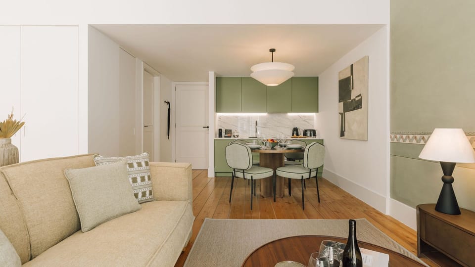 Elegant living area featuring textured chair, wooden desk, subtle lighting, and artistic touches for a sophisticated, cozy ambiance. 
#LivingRoom 
#InteriorStyling 
#DesignDetails
#AndoLiving