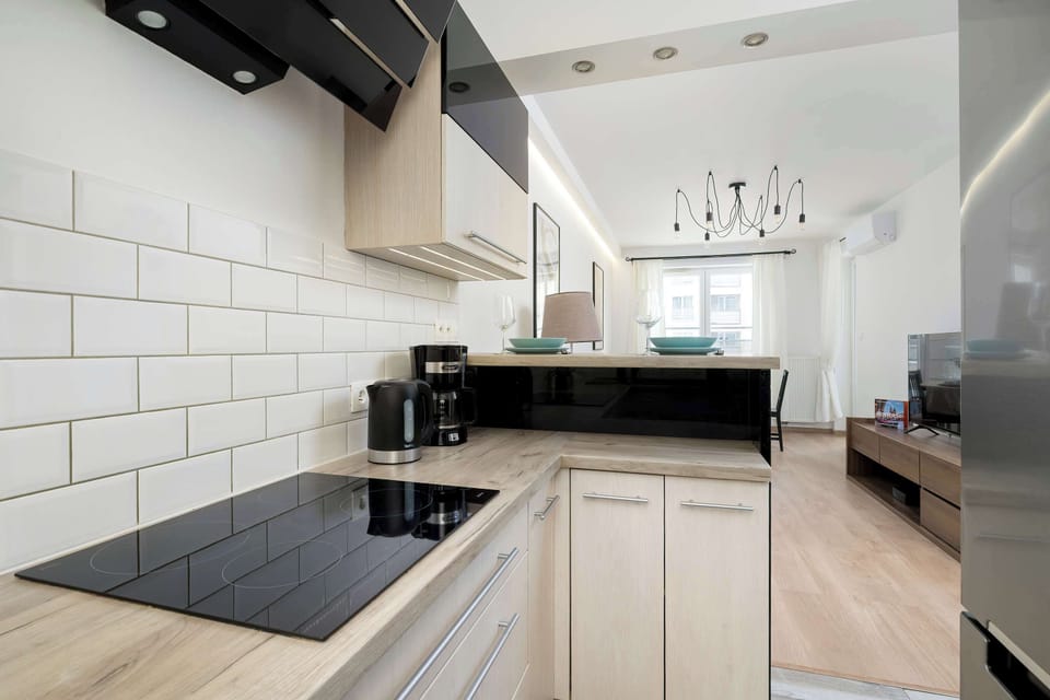 Clean kitchen counter with modern cooktop.