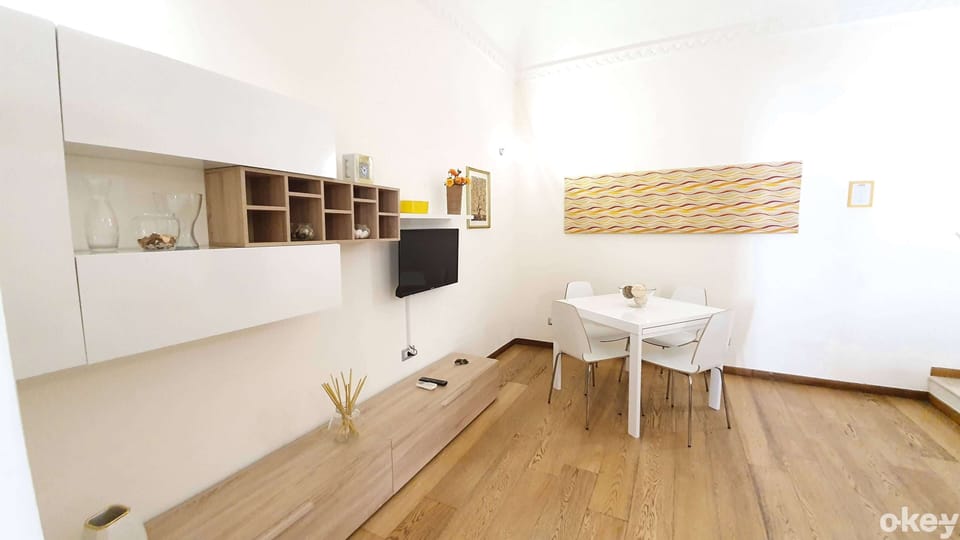 Apartment, Garden View | Living area | Flat-screen TV