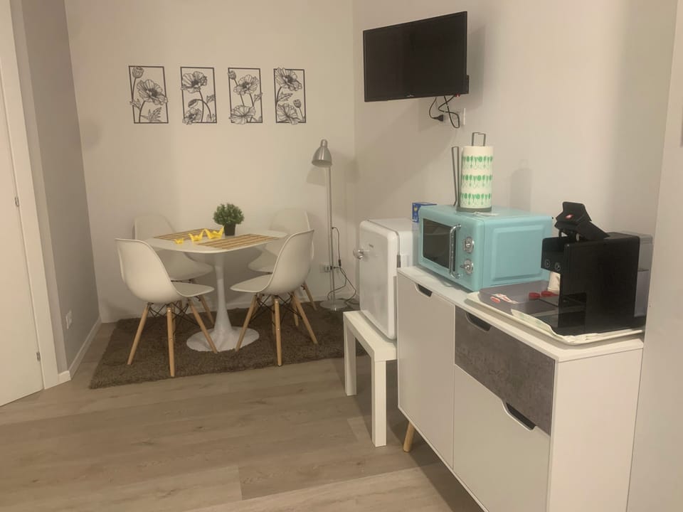 Deluxe Apartment, Patio | Living area | TV