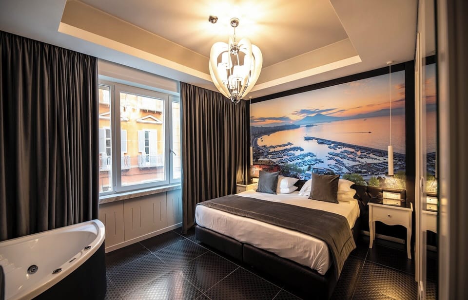 Deluxe Double Room, Partial Sea View | Minibar, in-room safe, free WiFi, bed sheets