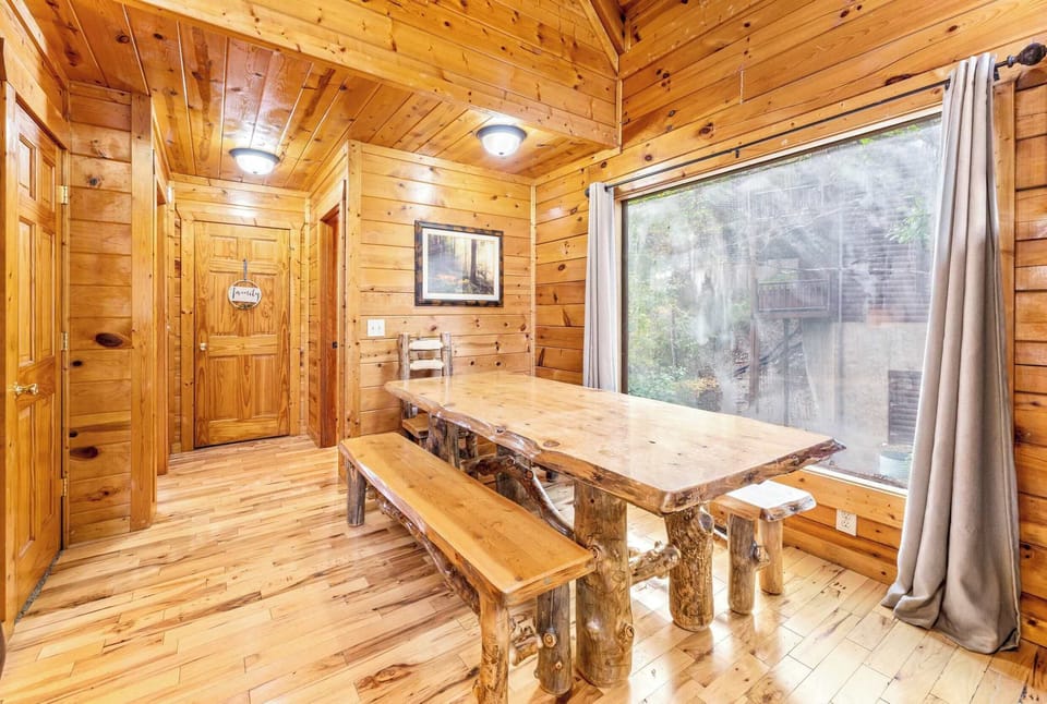 Rustic log dining table w/ ample seating for memorable meals!