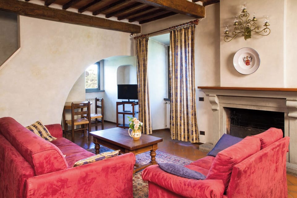 Design Apartment | Living area | 32-inch flat-screen TV with cable channels