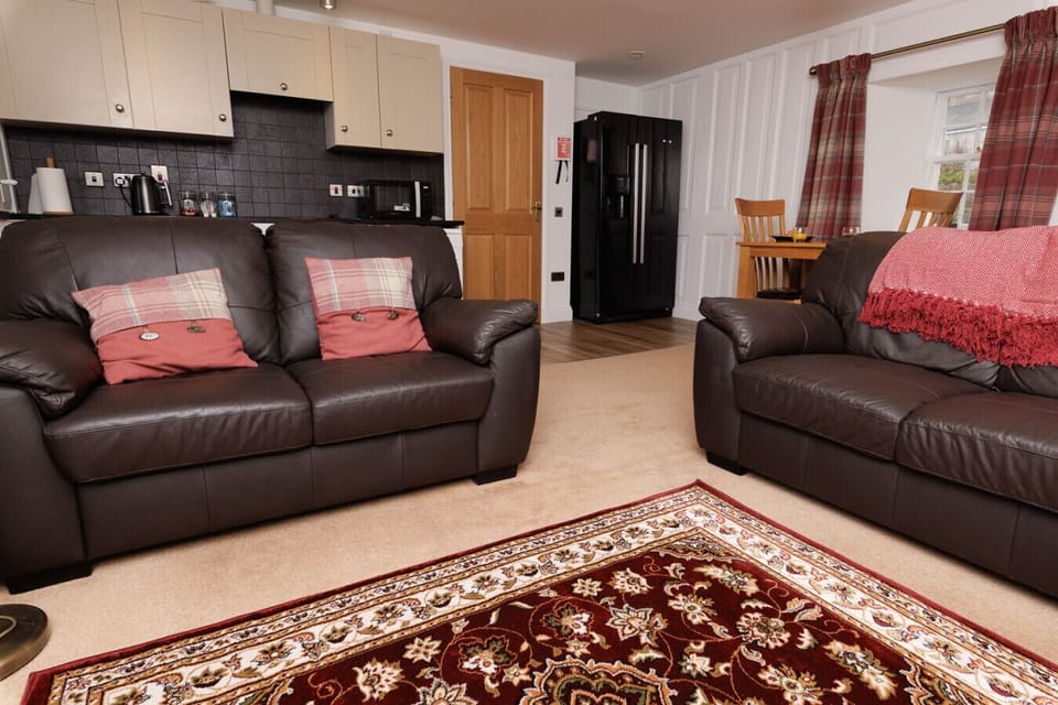 Open-plan living and dining area with a well-equipped kitchen
