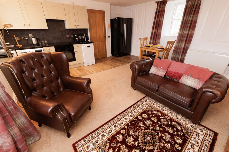 Open-plan living and dining area with a well-equipped kitchen