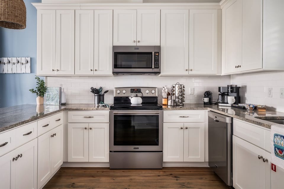 Step into a culinary haven where every meal becomes a masterpiece in our stylish and fully equipped kitchen.  "I loved that the kitchen was well stocked!" -Katie A.