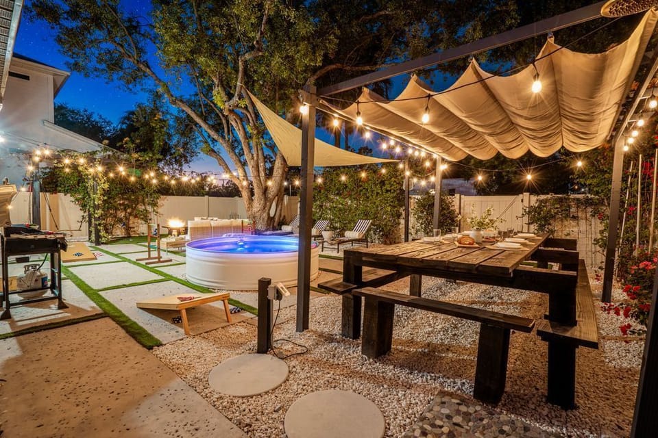 Multiple entertaining zones from pool to picnic table to games - this backyard was designed for making memories