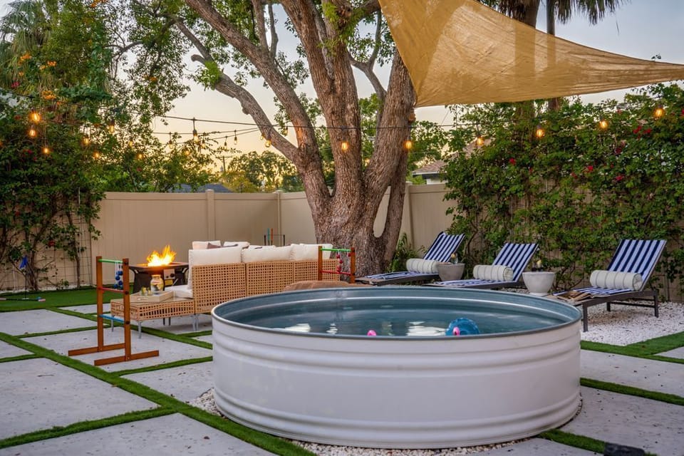 hlorine-free stock tank pool surrounded by lounge chairs - gentle on skin and perfect for refreshing dips