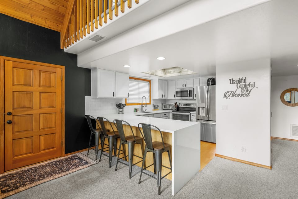 Modern kitchen and barstool seating for 4