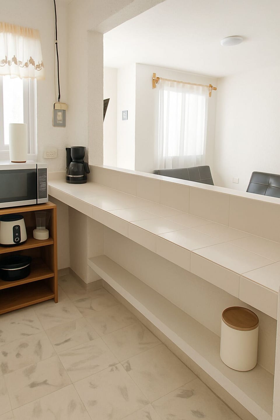 Kitchen counter with open shelving and essentials.