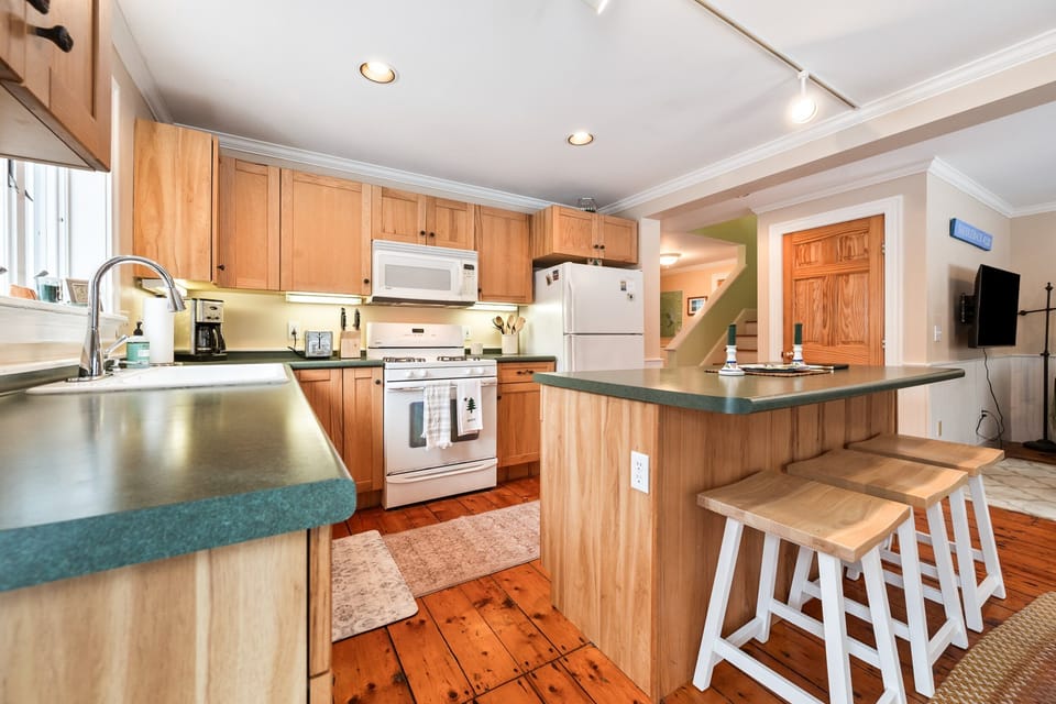 Kitchen with island seating for 3