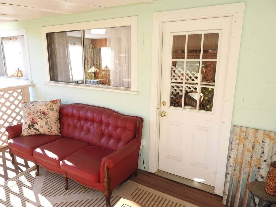 Covered patio with couches and chairs