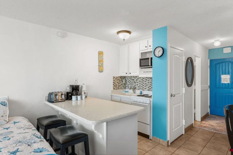 Cozy kitchenette with breakfast bar and all your morning essentials
