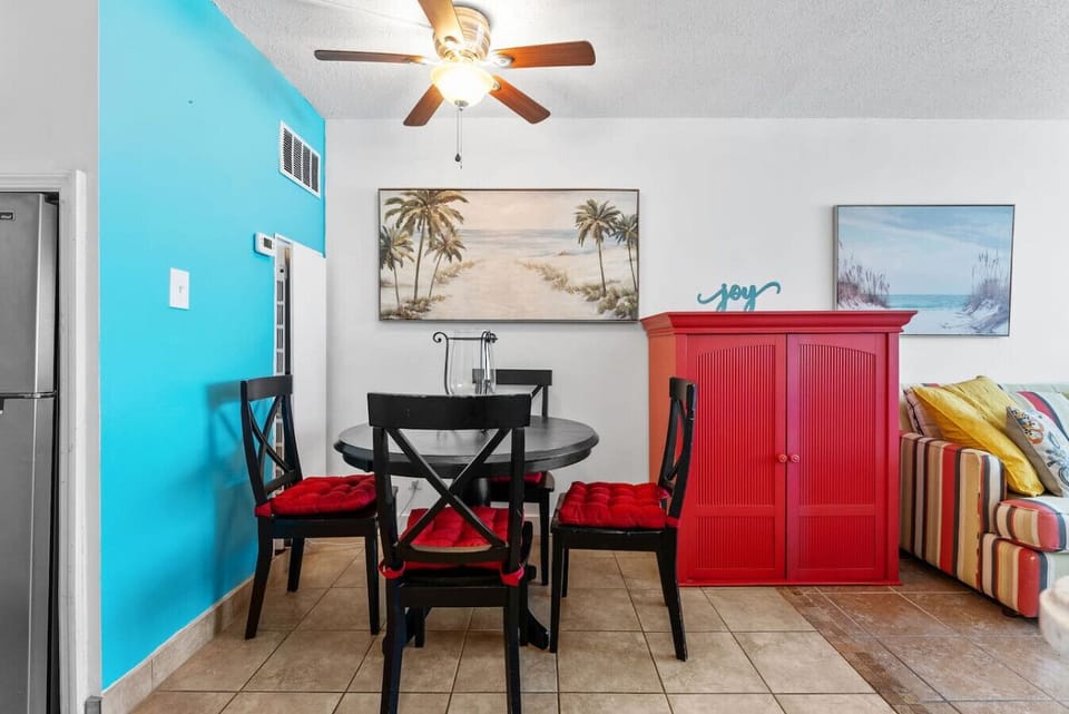 Colorful coastal dining area perfect for meals and relaxing after the beach