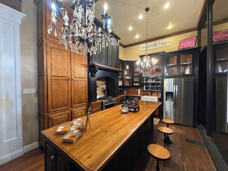 11 foot butcher block island with soda fountain-style barstools!