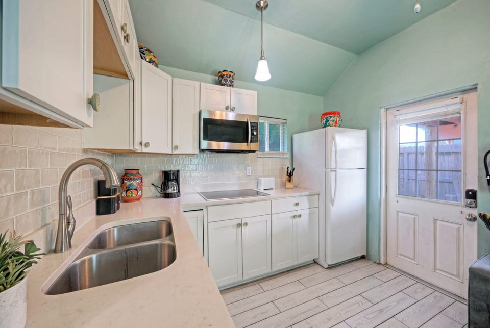 Functional kitchenette with ample counter space.