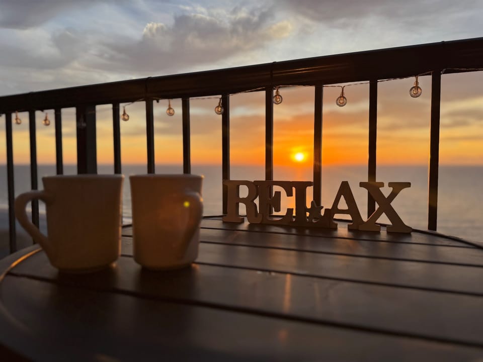Watch the Sunrise off the oceanfront balcony