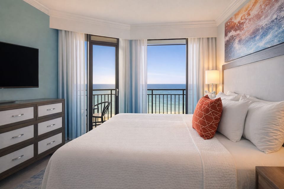 Wake up to ocean panoramas from your plush king bed.