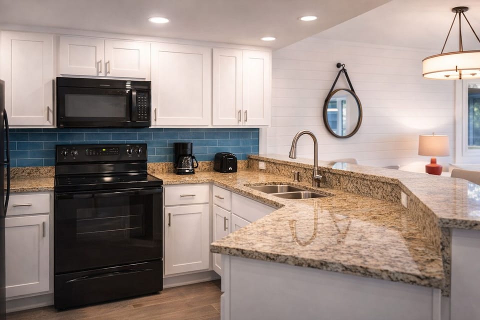 Cook effortlessly in the bright kitchen with generous granite counters.
