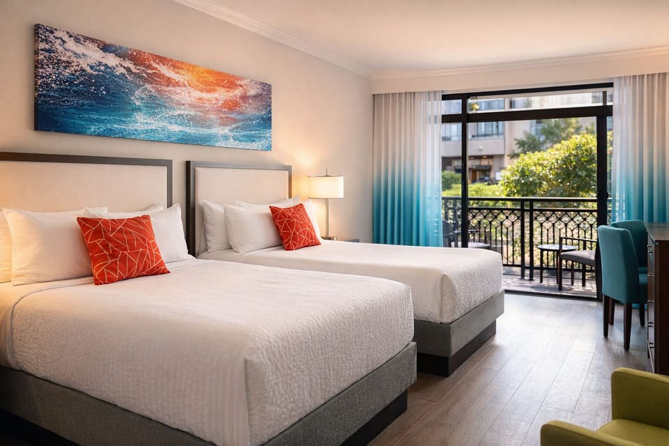Settle into crisp beds and drift off near the balcony.