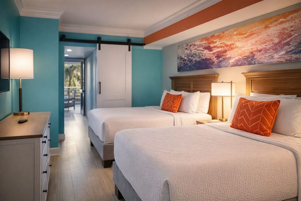 Stretch out on plush beds in a calm, coastal-inspired room.