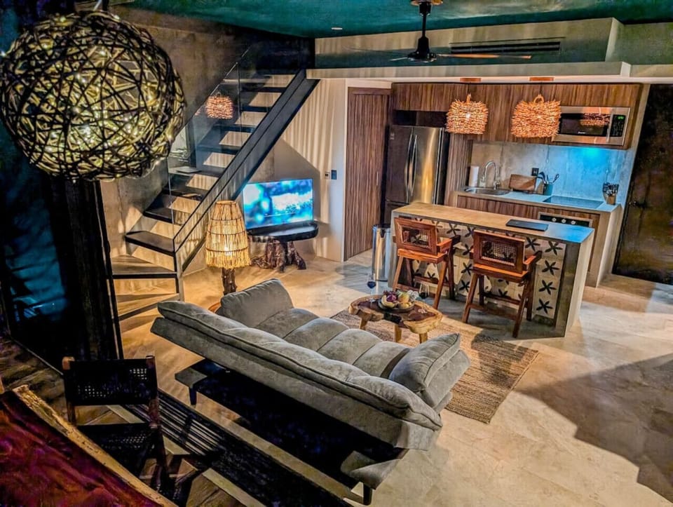Unwind in a cozy, sunlit living space — clean, comfy, and ready for your next TV binge!