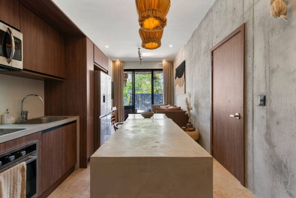 Enjoy a beautifully designed open-concept kitchen featuring modern appliances, ample counter space, and a stylish island ideal for dining and entertaining.