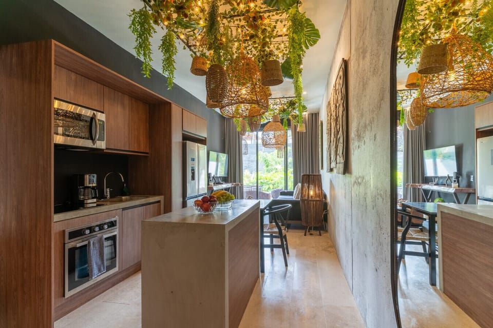 Enjoy cooking, dining, and gathering in a stylish space where contemporary design, artisan lighting, and thoughtful details create a warm and inviting atmosphere.